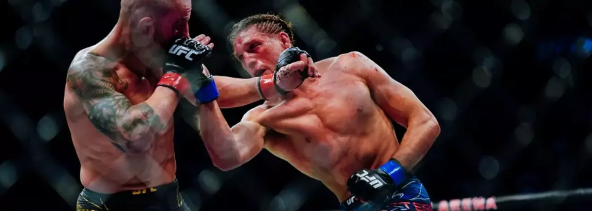 UFC má za sebou další krvavý boj o titul na pět kol. Pás zůstává šampionovi, přežil tři pokusy o submise